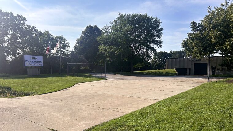 The Collision Solution monument sign and driveway at the 16th Street shop in Zion