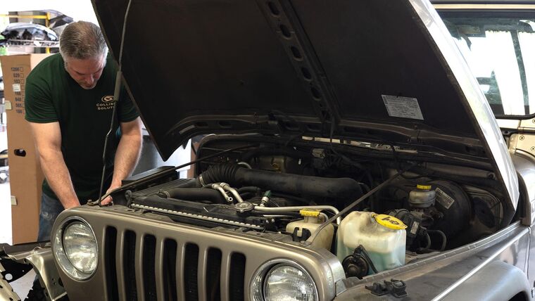 Technician performing collision repair at Zion