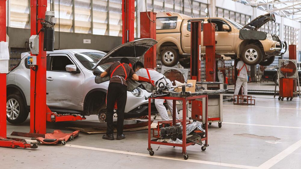 Collision Solution technicians at work in the repair bay