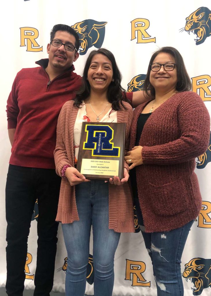 Round Lake High School's Daisy Alcantar with her parents